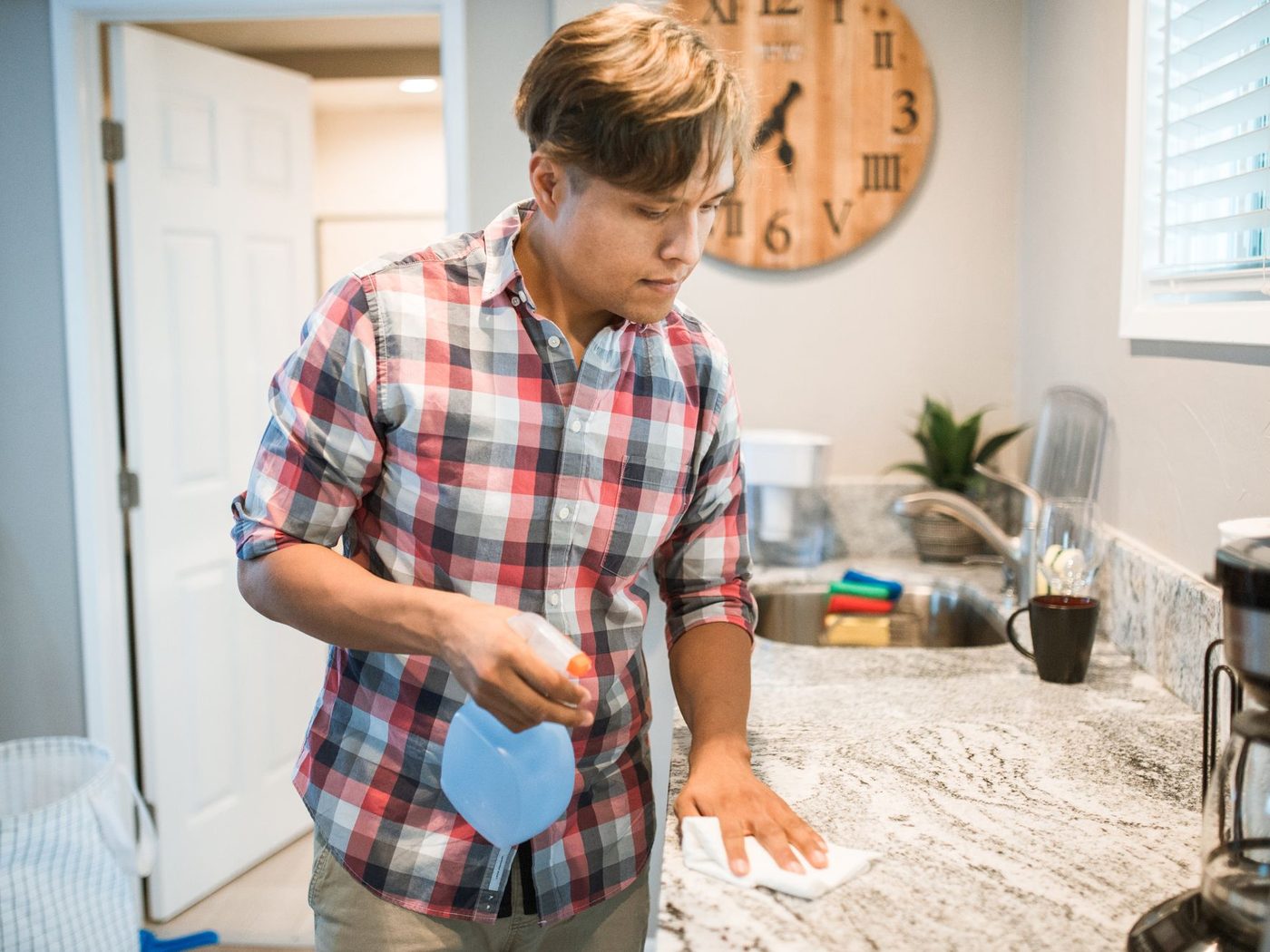 Wiping down a kitchen counter